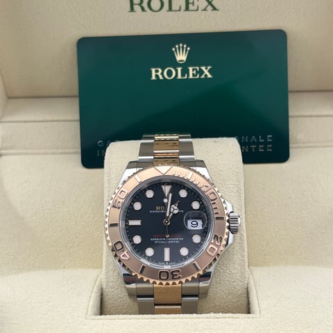 Rolex watch with mixed metal bracelet and dark blue dial
