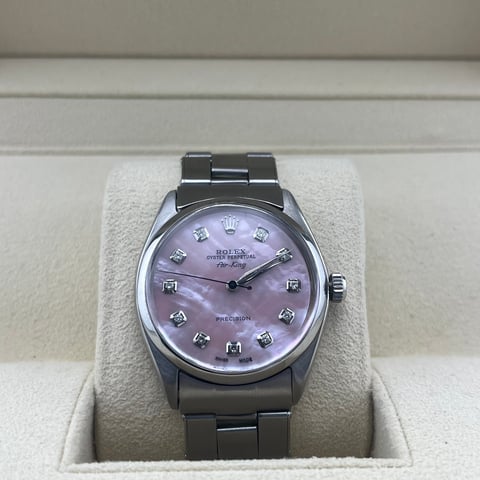 Stainless steel luxury watch with purple mother-of-pearl dial and diamond hour markers
