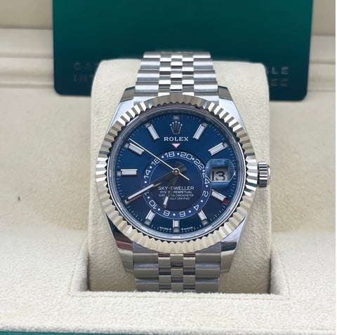 Rolex Datejust Sky-Dweller watch with stainless steel bracelet and dark blue dial on display in Rolex box