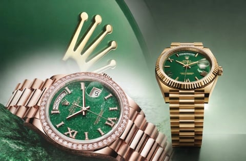Two luxury watches with green dials and a crown logo displayed against a green gradient background